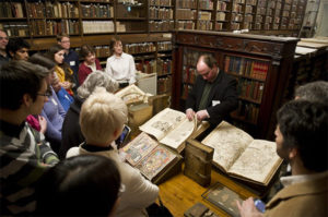 Special collections curator show books to a class