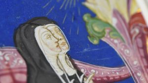 details of two nuns in profile from renaissance book