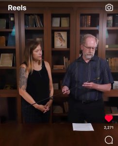 archivists with archival items in a library space