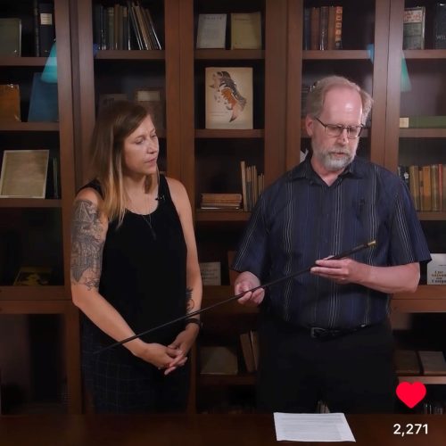 archivists with archival items in a library space