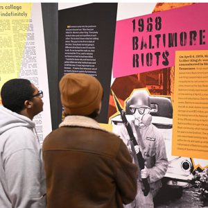 two students looking at civil rights exhibition