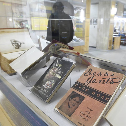 installation view of Black cookbooks on display