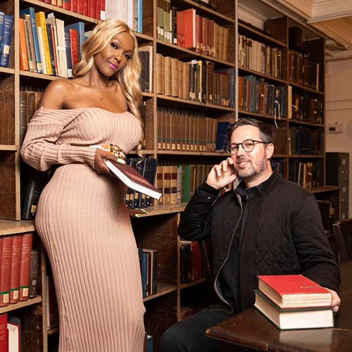 Rhonda Carr, a member of the Peabody Ballroom Experience board, and Dr. Joseph Plaster, a Johns Hopkins University curator in public humanities who is serving as an event coordinator, pose for a portrait at the George Peabody Library in Baltimore, Monday, April 11, 2023.