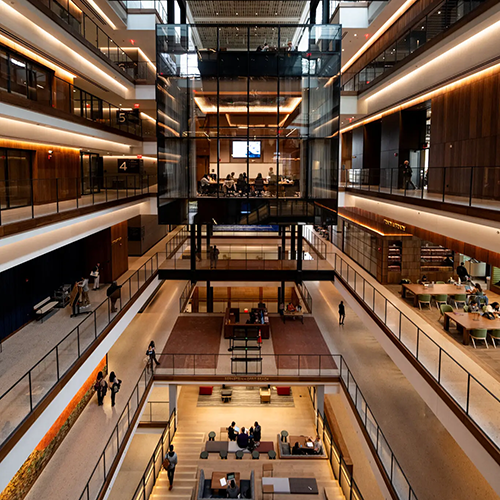 A view of the new atrium at the Johns Hopkins University Bloomberg Center, with glassed-in classrooms and a mini amphitheater on the ground floor. Erin Schaff/The New York Times