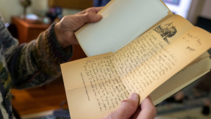 hands holding an old letter