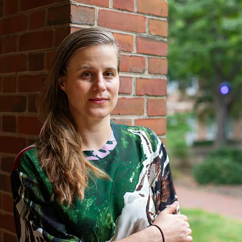 headshot of lauren groff standing outside against a brick wall