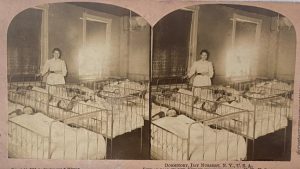 old photograph with nurse in a hospital nursery