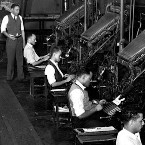 Photo of people working at press machines