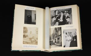 open scrapbook showing black and white photos