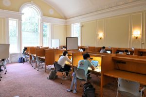 students working at library carrels