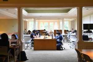 students studying in an academic library space