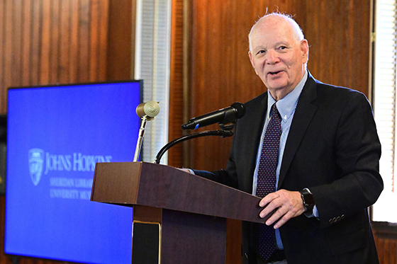 man standing at podium giving speech